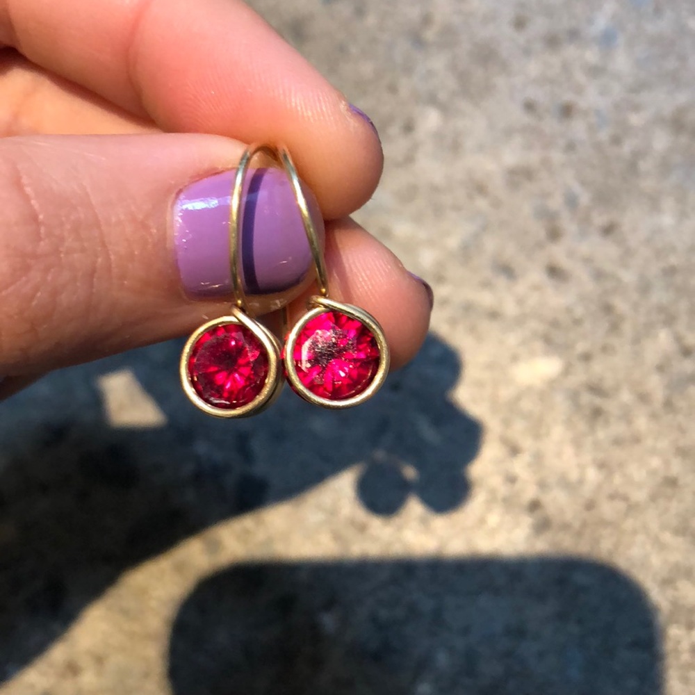 Gold earrings with red stone